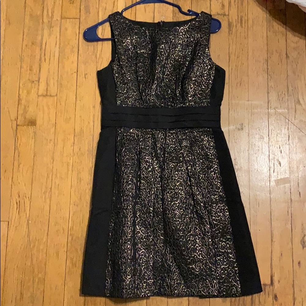 black dress with gold detail